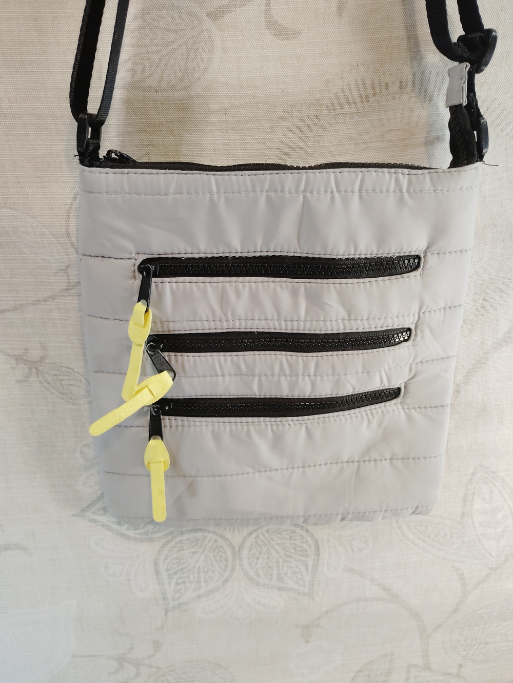 Light Gray Quilted Crossbody Bag with Yellow Zipper Pulls